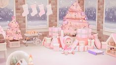 there is a pink christmas tree in the corner of this room with gifts and toys