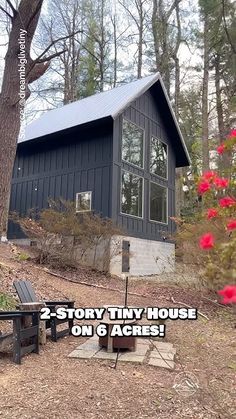 there is a small cabin in the woods with red flowers around it and text overlay that reads, 2 - story tiny house on 6 across