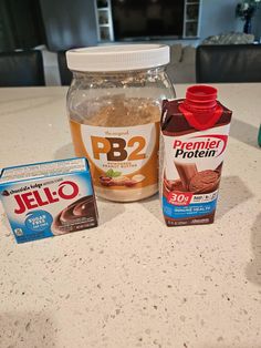 the ingredients for peanut butter, jello and chocolate pudding are sitting on the counter