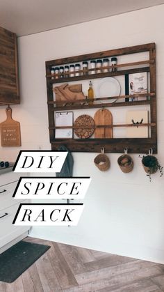 a wall mounted spice rack in a kitchen