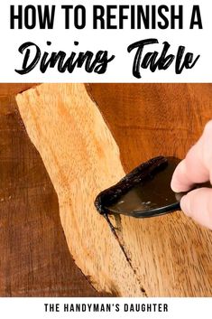 a person using a phone on top of a wooden table with text overlay reading how to refish a dining table the handyman's daughter