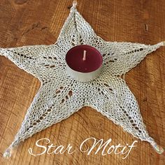 a star shaped candle holder on top of a wooden table with the words star moff written below it