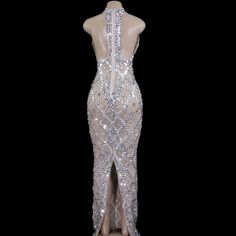 Silver Sequins Crystal Mesh Maxi Dress Details: Material: Polyester,Spandex Item Type: Dance Costume Length: Long Sleeve: Sleeveless Neck: Halter Colour: Silver Size: S,M,L,XL Gender: Female Age: Adult