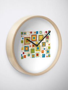 a wall clock with an abstract design on the front and back of it's face