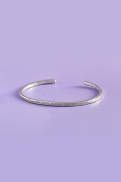 Crafted with minimalist elegance, the Lita Cuff is an adjustable cuff bangle made entirely from sterling silver for a luxurious look and feel. Wear it on its own for a minimal look, or pair it with other jewelry for a stunning combination. Handmade with care, the Lita Cuff will be a timeless addition to your accessories collection. Details925 Sterling SilverHandmade in our studioItem #7874-01 Minimalist Open Cuff Bracelet, Handmade Minimalist Cuff Bracelet For Everyday, Minimalist Adjustable Open Band Bracelets, Sterling Silver Open Cuff Bangle For Gift, Silver Open Cuff Everyday Jewelry, Minimalist Cuff Bracelet For Wedding, Sterling Silver Open Cuff Bangle As A Gift, Everyday Minimalist Handmade Cuff Bracelet, Minimalist Adjustable Open Band Bracelet