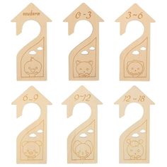 wooden numbers with animals on them and arrows in the shape of houses, one for each child