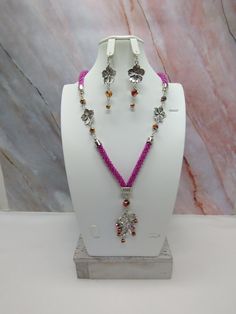 "Handmade and designed by me-one of a kind necklace set-spiral bead crochet necklace with fuchsia seed beads-22\" long-3\" long focal with a tree branch with glass crystal beads and an English cut crystal beads-glass crystal beads-flower connectors-metal beads-2 1/2\" long matching dangle earrings with an English cut glass crystal bead and a flower connector-1 1/2\" extender chain-lobster clasp-antique silver tone findings. Add this one of a kind necklace set to your jewelry wardrobe or give it as a unique gift!" Adjustable Pink Crochet Jewelry, Bohemian Pink Crochet Jewelry, Pink Crochet Dangle Jewelry, Rope Crochet, Crochet Beaded Necklace, Pretty Necklaces, Necklace Unique, Bead Crochet, Unique Necklaces