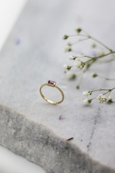 Pretty in Pink! A perfectly cut baguette Sapphire ring handmade to perfection. Its pink beauty forms a saccharine treat making it a candy ring. It can be stacked with all the colours of the rainbow. I definitely won’t think twice when buying this stunning gem. Emerald Cut Pink Ruby Ring In Fine Jewelry Style, Pink Emerald Cut Ruby Ring In Fine Jewelry, Pink Ruby Stackable Jewelry, Yellow Gold Emerald Cut Ruby Ring Gift, Fine Jewelry Pink Amethyst Ring For Gift, Pink Emerald Cut Tourmaline Jewelry, Pink Emerald-cut Tourmaline Jewelry, Emerald Ring With Rectangular Stone As Gift, Yellow Gold Emerald Ring With Rectangular Stone For Gift