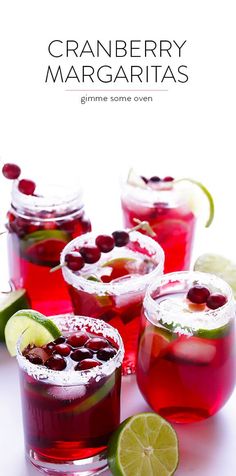 cranberry margaritas are garnished with lime and cherries