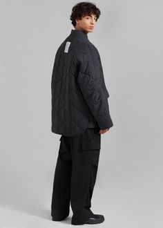 Color: Black Midweight soft woven fabric Relaxed fit High rise Wide leg Front pleat detailing Slant hip pockets Enlarged illusion cargo pockets on leg Darted detailing Zip fly Front button closure Unlined 78% Polyester 20% Rayon 2% Polyurethane Dry Clean By The Frankie Shop. Imported Denim Suit, The Frankie Shop, Frankie Shop, Paris Woman, Oversized Jacket, Oversized Silhouette, Swimwear Accessories, Quilted Jacket, Cargo Pants