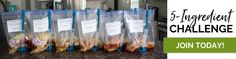 five bags filled with food sitting on top of a counter next to a stovetop