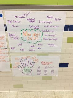 two bulletin boards with writing on them in front of a white tiled wall and floor