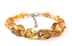 Rare Padparadscha Sapphire Nugget Beads Multi Yellow Orange Sapphire Gemstone 3 Bracelet Beads Sparkle Sapphire Beads 7 inch bracelet  Product -; Padparadcha Sapphire Grade-: AAA High Quality Stone shape-:  Beads Shape Color= Orange Yellow Length-: 7 Inch Quantity -: 1 Strand  Genuine Measurements and weight are close to approximations We accept bulk or wholesale orders for any gemstone which you'll get best wholesale prices! Hence you can contact me with your requirement of bulk or wholesale or Amber Beaded Bracelets With Natural Stones, Elegant Amber Bracelets With Polished Beads, Amber Beaded Bracelets With Round Beads, Amber Bracelets With Colorful Round Beads, Amber Beaded Bracelets, Amber Bracelets With Colorful Beads, Amber Beaded Bracelets For Healing, Adjustable Amber Bracelet With Large Beads, Adjustable Amber Bracelets With Large Beads