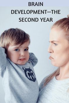 a woman holding a baby in her arms with the caption brain development - the second year