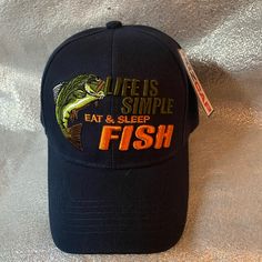 Enjoy The Fishing Season And Keep The Glare Of The Sun Away From Your Eyes With This New Embroidered Navy Blue Fishing Hat Life Is Simple Eat Sleep Fish. Perfect Fishing Accessory Whether You Are Bass Fishing, Trout Fishing Or Hanging Out On The Boat At The Lake With A Cold One. This Comfortable Polyester Hat Goes Perfect With Any Fishing Outfit. Velcro Adjustment On Back Of Baseball Cap Makes It A Great Fishing Hat For Men, Women, Ladies, Kids Or Teens. Fishing Lake Stream Bass Trout Novelty Fu Casual Blue Trucker Hat For Fishing, Blue Curved Brim Fishing Hat, Fishing Hats For Men, Fishing Outfit, Fishing Trout, Life Is Simple, Kangol Hats, Fishing Lake, Carhartt Beanie