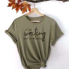 In The Waiting, God Is Working Short Sleeve T-Shirt Inspirational Crew Neck T-shirt For Everyday, Inspirational Crew Neck Soft-washed T-shirt, Inspirational Soft-washed Crew Neck T-shirt, God Is Working, Christian Shirts Designs, Faith Clothing, Cute Shirt Designs, Work Shorts, Faith Shirt