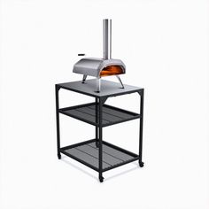 an outdoor pizza oven sitting on top of a shelf