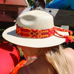 Get ready to stand out in style with the Handwoven Panama Hat! These hats are handcrafted in Ecuador and feature a stylish band handmade in Mexico. Each hat is one-of-a-kind to add an extra touch of individuality. Stay cool and chic with this one-of-a-kind accessory! Details: Hats are locally designed by a woman owned capsule hat company Panama style hat Handcrafted in Ecuador with Toquilla straw Hat Size is: 7 1/8- 7 1/4 22 3/8- 22 7/8 inches Festival Fedora With Short Brim In Natural Color, Artisan Brimmed Boater Hat For Summer, Handwoven Adjustable Boater Hat With Flat Brim, Natural Fedora With Short Brim For Festivals, Handwoven Natural Hat Band With Flat Brim, Adjustable Handwoven Boater Hat With Flat Brim, Natural Short Brim Fedora For Festival, Western Handwoven Panama Hat With Flat Brim, Woven Fedora Hat In Toquilla Straw