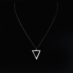 Show your spunky spirit in geometric style with the triangle pendant necklace. Crafted in stainless steel on a bold chain, this savvy accent adds a spicy, mathematical touch to your look. This is dynamic masculinity - no limits, no boxes, just you at your sharpest. For the modern man who isn't afraid to take bold angles in pursuit of progress and self-betterment - be you, but better. When it comes to men's necklaces, stainless steel offers strength, shine, and street cred. Stainless Steel necklaces interlock metal rings, discs, or beads in badass textures, perfect for the modern man. From chunky Cuban links with an edgy urban appeal to low-key beads that let pendants pop, the BERML stainless chains have range. There's the classic cable chain, those oval interconnected links that became fam Luxury Men's Necklace With Square Pendant, Elegant Triangle Metal Jewelry, Luxury Men's Square Pendant Jewelry, Modern Black Triangle Jewelry, Minimalist Triangle Metal Necklace, Silver Triangle Metal Necklace, Triangle Pendant, Pearl Choker Necklace, Pearl Choker