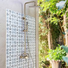 a shower head and hand held shower faucet in a bathroom