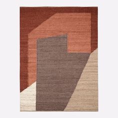 an area rug with various colors and shapes on the floor, including brown, orange, beige