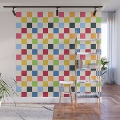 a multicolored checkerboard wall mural in a living room