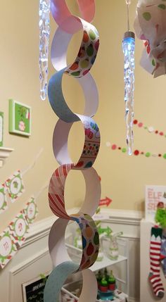 a wind chime hanging from the ceiling in a child's room with decorations