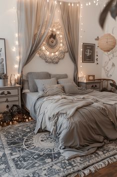 a bedroom decorated in neutral tones with fairy lights