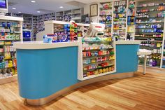 the inside of a pharmacy store with shelves full of medicine