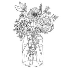 a vase filled with lots of flowers on top of a table