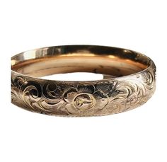 "This timeless gold-filled bracelet, designed in the Victorian style, boasts exquisite floral etching on its front, with its original monogram on the reverse side. A statement piece on it's own or can be added to your favorite wrist stack! Details: * Gold Filled  * Etched floral design  * 7\" circumference * Original monogram on reverse" Luxury Antique Carved Bangle, Luxury Antique Gold Bracelet Engraved, Wrist Stack, Wrist Stacks, Tennis Necklace, Leather Cuffs Bracelet, Teardrop Necklace, Bride Jewellery, Leather Cuffs