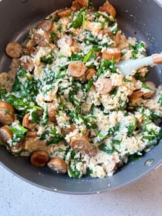 a bowl filled with rice and vegetables on top of a table