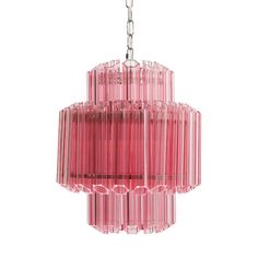 a pink chandelier hanging from a ceiling