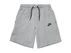 Nike Kids NSW Tech Fleece Shorts (Little Kids/Big Kids) - Boy's Clothing : Dark Grey Heather/Black : Have him out playing in a casual sporty look with the Nike Kids NSW Tech Fleece Shorts. These lightweight cotton-blend shorts are constructed with an elasticized drawstring waist, side pockets, vertical zippered pocket at the back right and signature swoosh logo at the front left thigh to give his style a trendy finish. Pull-on construction. Relaxed fit cut. 69% cotton, 31% polyester. Machine was Nike Pro Shorts For Kids, School Clothes List, Nike Tech Shorts, Cool Shorts For Kids, Sweatpant Shorts, Boys Nike Shorts, Spooky Basket, Bedroom Retro, Design Jeans