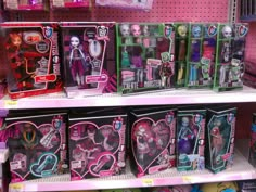 there are many monster dolls on display in the store