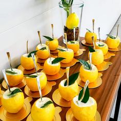 a table topped with lots of yellow fruit