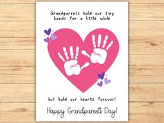 a card with two handprints on it that says grandparents hold our tiny hands for a little while but hold our hearts forever