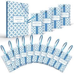 a set of blue and white gift tags with ribbon ties on the front, back and side of each package