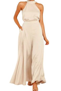 The Jumpsuit is made from a shiny, supple, and silky soft satin-like fabric, it's the epitome of style and elegance. Material: 60% Polyester, 40% Elastomultiester Color: Champagne Beige Details: Back Closure with Bow, Wide Legs, sideseam pockets Sizes: S to XL Gender: Female Age: Adult Brand Name: NoEnName_Null Product ID: CJLS114729401 *CM to INCH converter Please check the size chart carefully before you buy the item. Note:All sizes are 1 to 2 sizes smaller than European and American people. C Elegant Full-length Stretch Jumpsuits, Elegant Stretch Jumpsuits And Rompers In Solid Color, Elegant Satin Jumpsuit Or Romper In Solid Color, Elegant Satin Jumpsuits And Rompers For Summer, Solid Satin Jumpsuits And Rompers For Night Out, Elegant Summer Full-length Jumpsuits And Rompers, Solid Color Evening Pantsuit For Summer, Sleeveless Satin Jumpsuit Or Romper, Solid Color Pantsuit For Evening In Summer