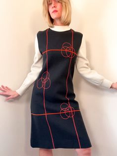 ⚡️ unique and rare 1960s space age mod-style shift dress with geometric pattern, mock neckline, and long sleeves. No remaining label. the material is a wool-blend knit with some sort of stretch built in. sturdy, warm, and holds its shape. excellent condition for an item of this age and kind! ⚡️ no labeled size, fits size medium  (modeled on size small, 5'5") ⚡️ shoulders 15.5" chest 18" waist 7"  length 39" sleeve length 23" ----------------------------------------------------------------------- 60s Space Age, 1960s Space Age, Space Age Fashion, 60s Mini Dress, Dress Geometric, Shift Dress Pattern, Mod Style, Mod Fashion, Mod Dress