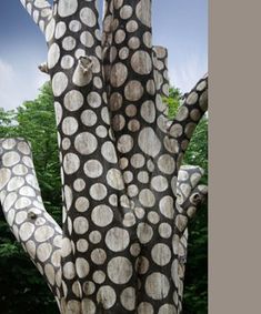 a large wooden sculpture with white circles on it