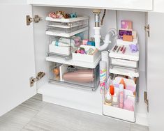 the inside of a bathroom cabinet filled with lots of items