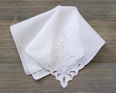 10% Off 2 or More Code SAVE10 Vintage Wedding Handkerchief ~ This all white hankie features embroidered flowers, appliqué lace and french knots, all on one accent corner.  There is floral embroidery on each of the other corners also. The needlework is exceptional.  It is made of soft cotton and has a rolled hem. A perfect 'something old' and something beautiful for the bride!  Measures 12 x 12 inches Thanks for visiting → RoseAnaDana.Etsy.com . Classic White Wedding Handkerchiefs, Classic White Embroidered Handkerchiefs, Elegant White Handkerchiefs With Floral Embroidery, Elegant White Floral Embroidered Handkerchiefs, Traditional White Handkerchiefs With Floral Embroidery, White Floral Embroidery Handkerchiefs For Gift, White Floral Embroidered Handkerchiefs For Gifts, Elegant White Handkerchiefs With Machine Embroidery, Formal White Embroidered Handkerchiefs