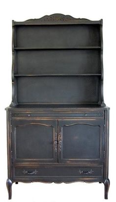 an old fashioned black china cabinet with two doors and one drawer on the bottom shelf