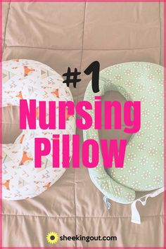 two nursing pillows sitting on top of a bed with the words nursing pillow written above them