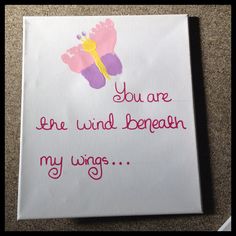 a handprinted card with the words you are the wind beneath my wings on it