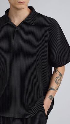 One Size. Fits XS-LColor: BlackPleated MaterialQuarter Button UpShort Sleeve100% PolyesterDry Clean OnlyBy The NKC Store Product MeasurementsChest: 132cm / 52inLength: 66.04cm / 26in Model is 185cm / 6'1" wearing size O/S Black Shirt With Polo Collar And Relaxed Fit, Black Tops With Buttoned Collared Neckline, Black Tops With Collared Neckline And Buttons, Black Tops With Buttons And Collared Neckline, Black Collared Top With Buttons, Black Collared Top With Button Closure, Black Top With Button Closure And Collared Neckline, Black Polo Collar Top With Button Closure, Black Top With Button Closure And Polo Collar