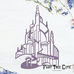 a paper cut out of a castle surrounded by blue flowers and greenery with the words fairy tale lite on it