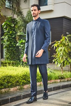 Navy blue double paneled jacket style bandhgala with pintucked details on front. Comes with coordinating pant. - Aza Fashions Tailored Long Sleeve Bandhgala For Designer Wear, Tailored Blue Nehru Jacket With Long Sleeves, Tailored Blue Nehru Jacket, Blue Tailored Long Sleeve Nehru Jacket, Designer Tailored Bandhgala With Notch Lapel, Designer Long Sleeve Tailored Kurta, Designer Tailored Long Sleeve Kurta, Tailored Long Sleeve Bandhgala For Eid, Elegant Blue Bandhgala For Workwear