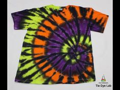 an orange, purple and green tie - dyed t - shirt on a white background